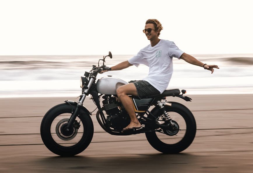 Person riding bike on beach